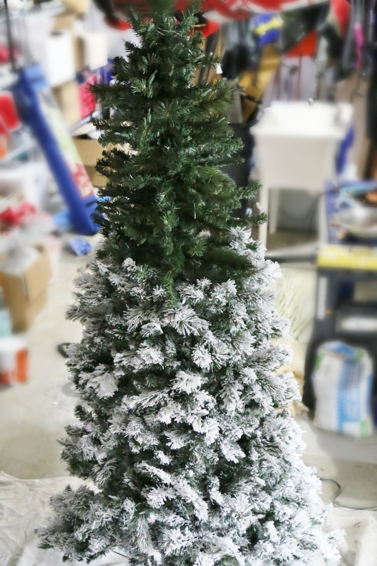 DIY Flocked Christmas Tree with White Spray Paint and Snow